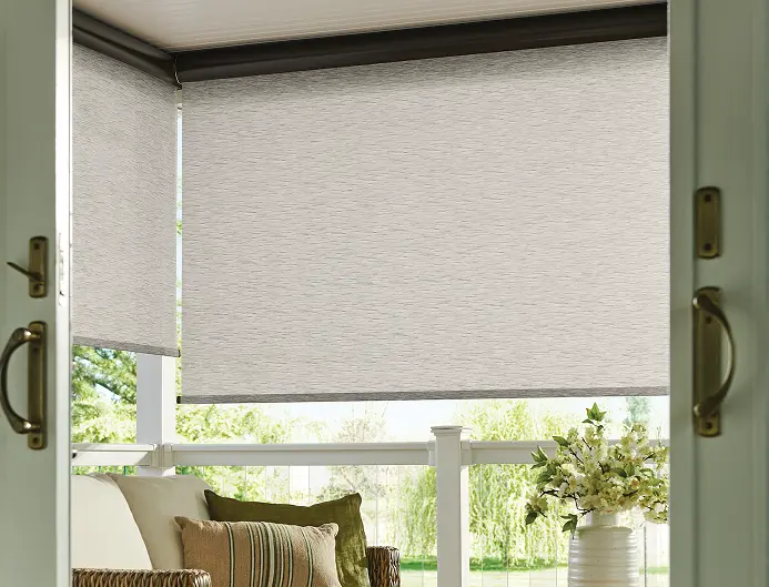 exterior solar shades installed in a sunroom reducing heat and glare